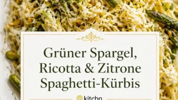 Spaghetti-Kürbis mit Spargel, Ricotta, Zitrone und Thymian auf einem Teller